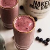 Two tall glasses of power berry smoothie.