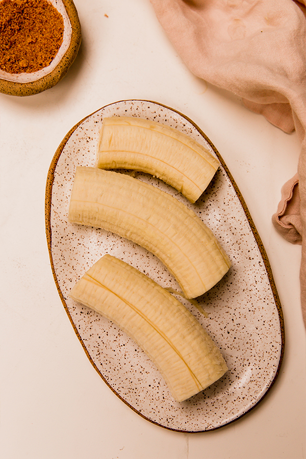 A plate with slices of banana.