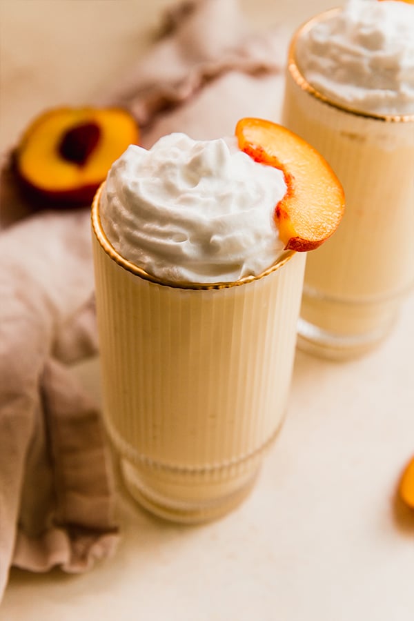 A dairy free creamy peach milkshake.