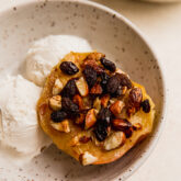 Dairy-free ice cream and a baked apple in a bowl.