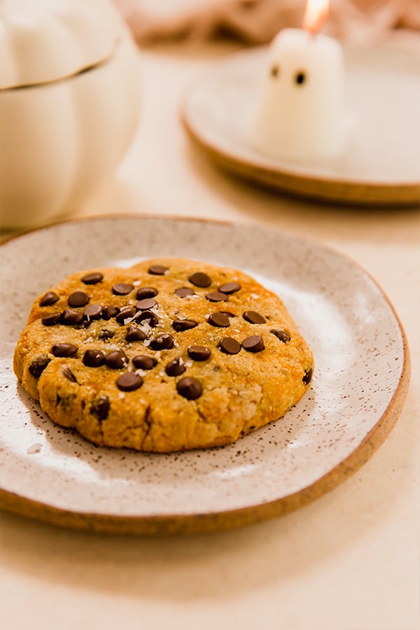 A single serve pumpkin cookie on a plate.
