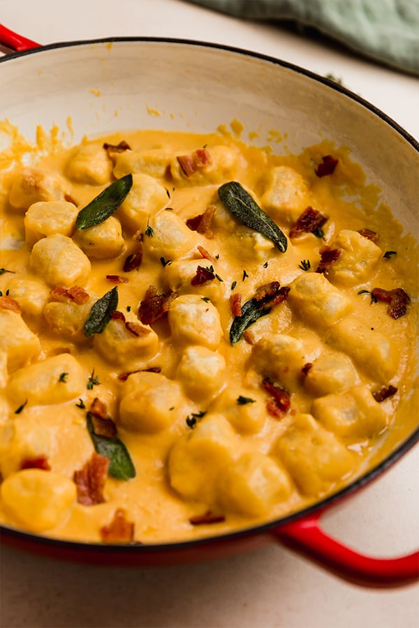 butternut gnocchi in a large red pan
