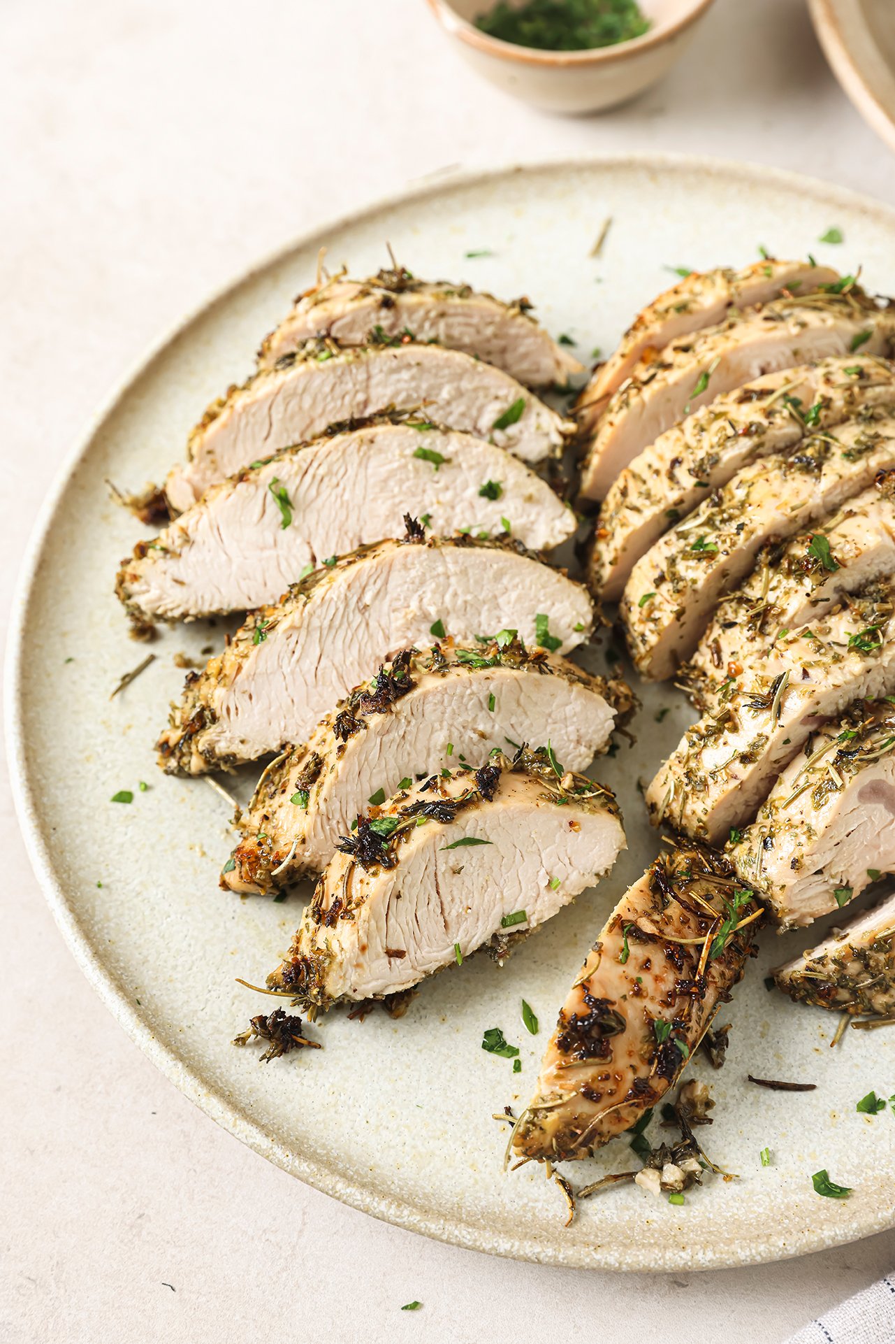 Turkey tenderloin sliced on a plate.