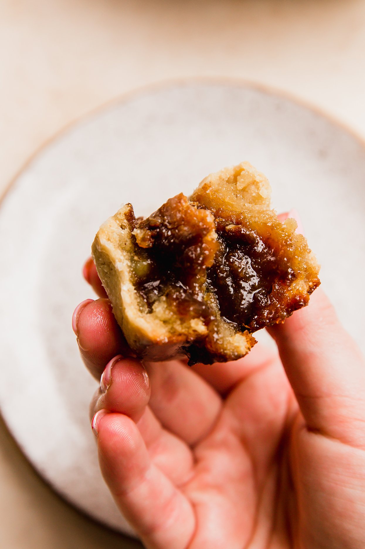 Gooey gluten free gingerbread cinnamon rolls bitten in half.