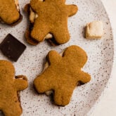 Plate of gingerbread s'mores cookies.