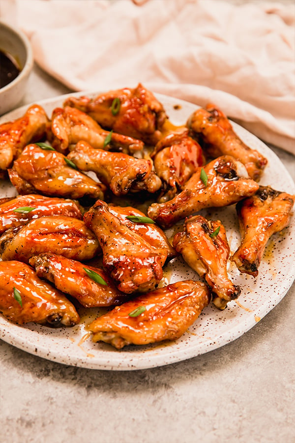 A plate of baked honey-garlic chicken wings.