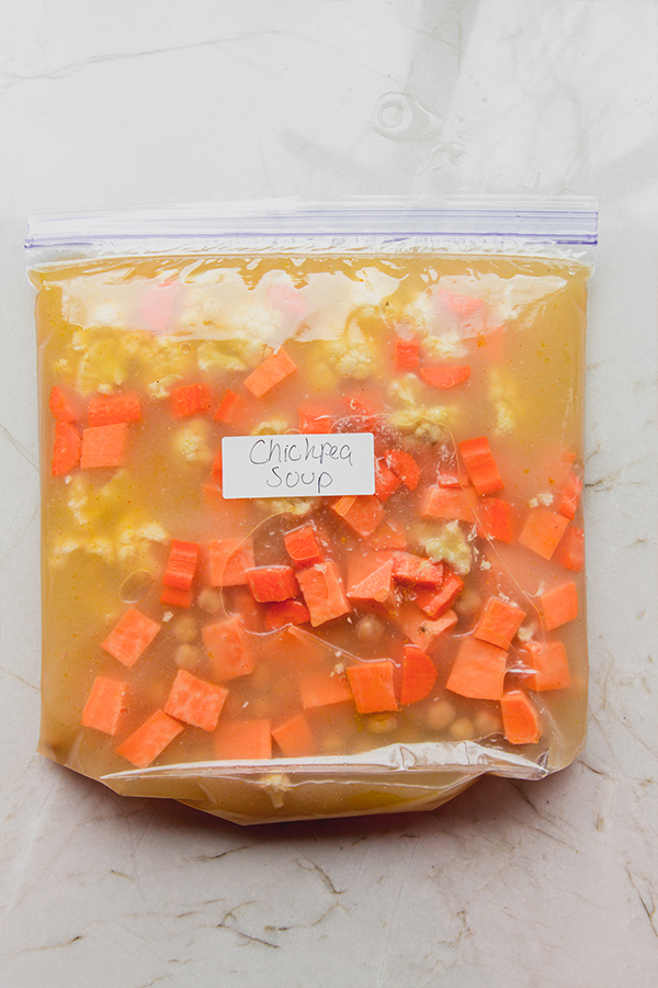 A bag of chicken soup ready for the freezer.