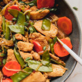 Dish of chop suey with a spoon.