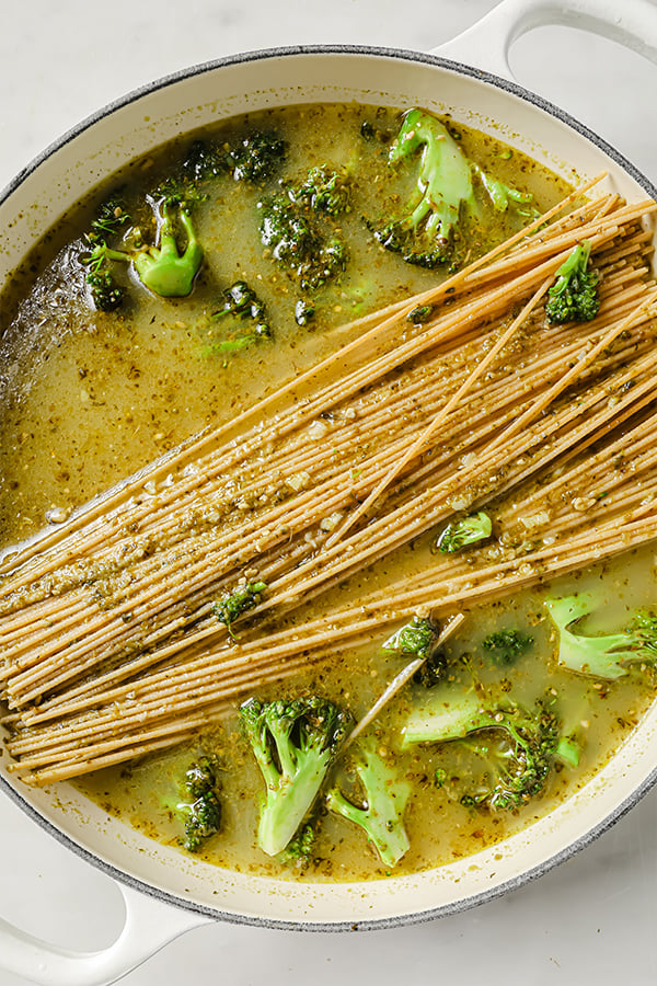 uncooked one pot pesto pasta in a large pot. 