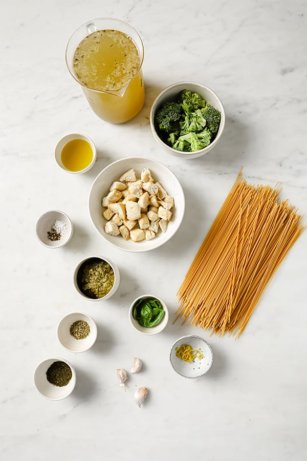 One pot pesto pasta ingredients in seperate bowls 