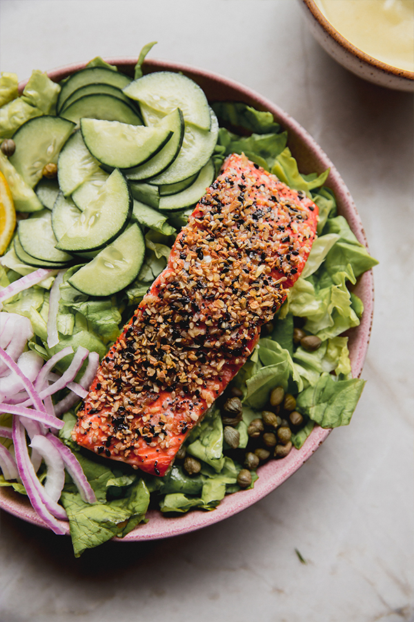 A bowl filled with the everything bagel salmon salad.