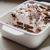 Partially-served ice box cake in a baking dish.