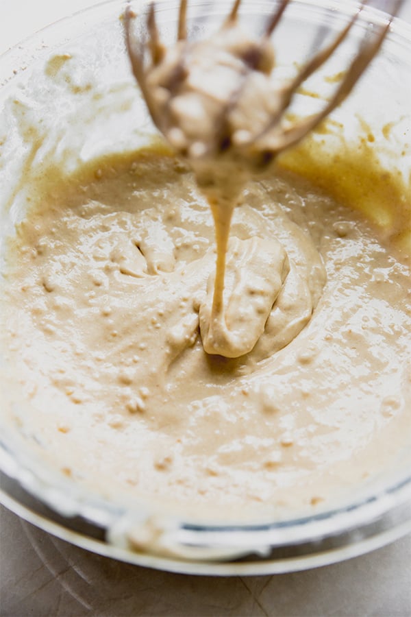 A bowl of pancake batter in a glass bowl.