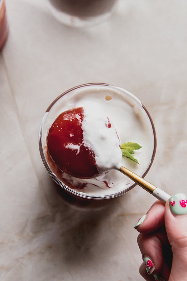 A spoon taking a bite of Sicilian watermelon pudding.