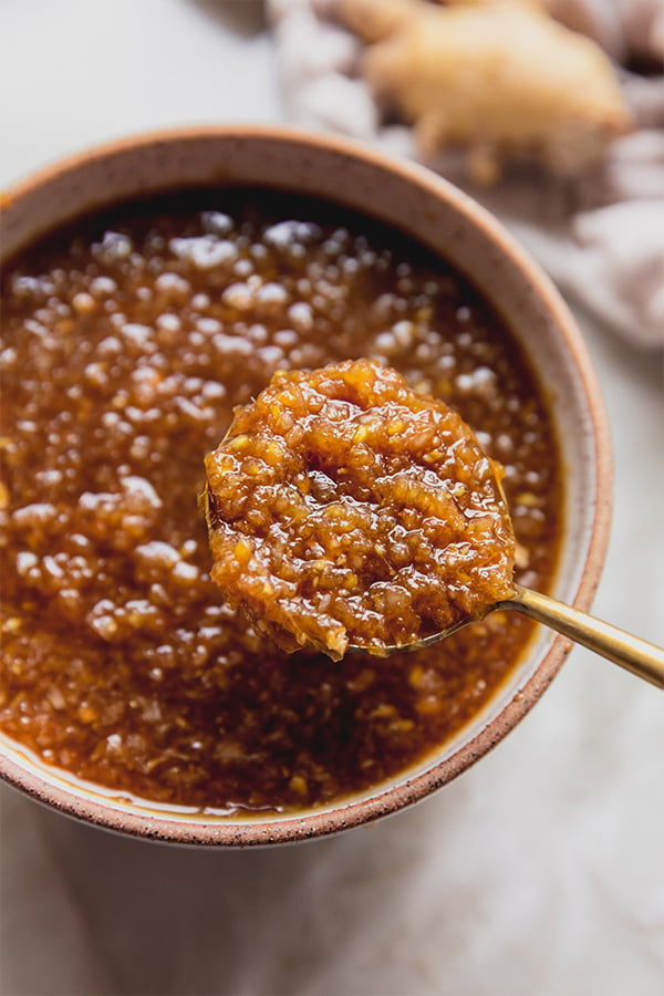 A bowl of hibachi ginger sauce with a spoon in it.