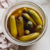 Container of apple cider vinegar pickles.
