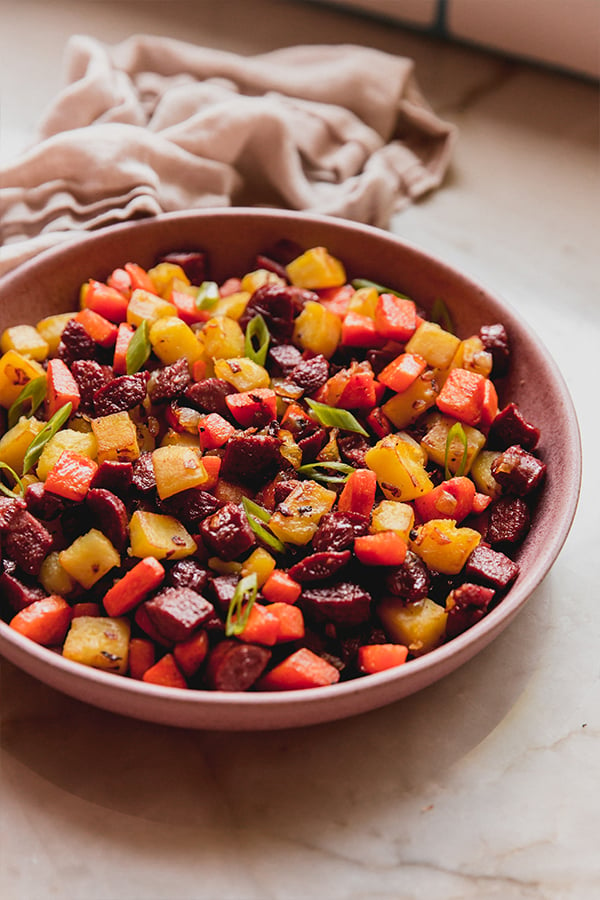 A bowl of healthier hot dog and veggie hash.