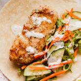 Ranch over chicken and vegetables in a tortilla.