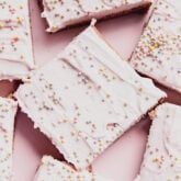 Funfetti pink sugar cookie bars on a pink plate.