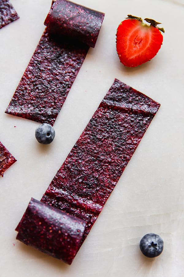 The homemade fruit roll-ups unrolled on a counter.