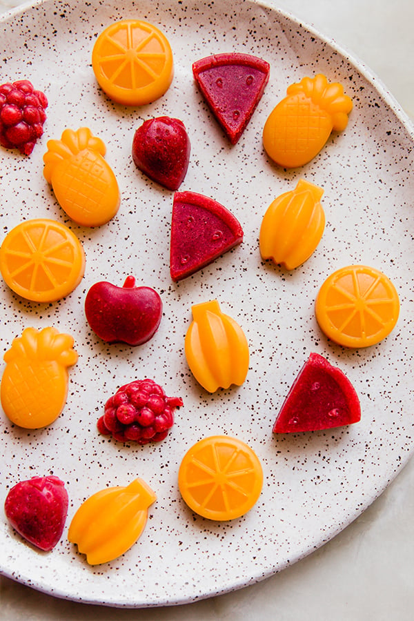 A plate of homemade fruit snacks all spread out.