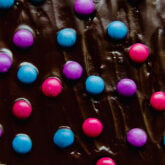Colorful candies on almond flour brownies.