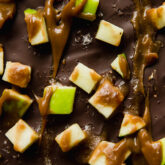 Caramel apple graham cracker bark with green apple pieces.