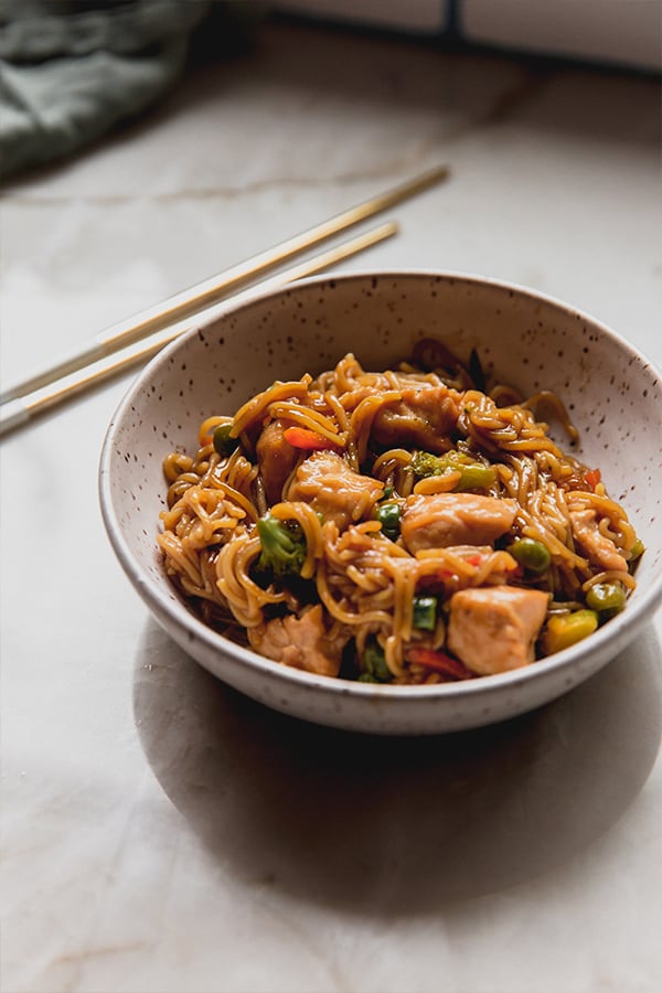 A bowl of gluten-free ramen sitting on a counter.