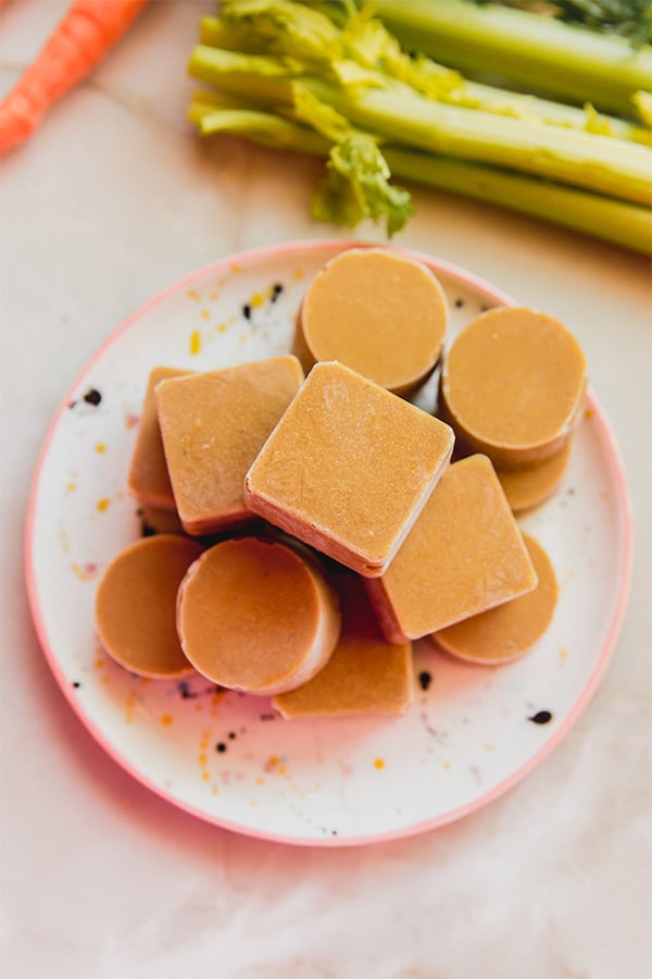A stack of homemade beef bouillon cubes on a counter.