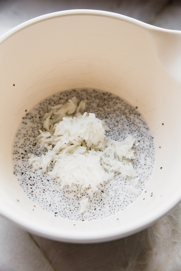 A bowl of sticky rice chia pudding being mixed together.