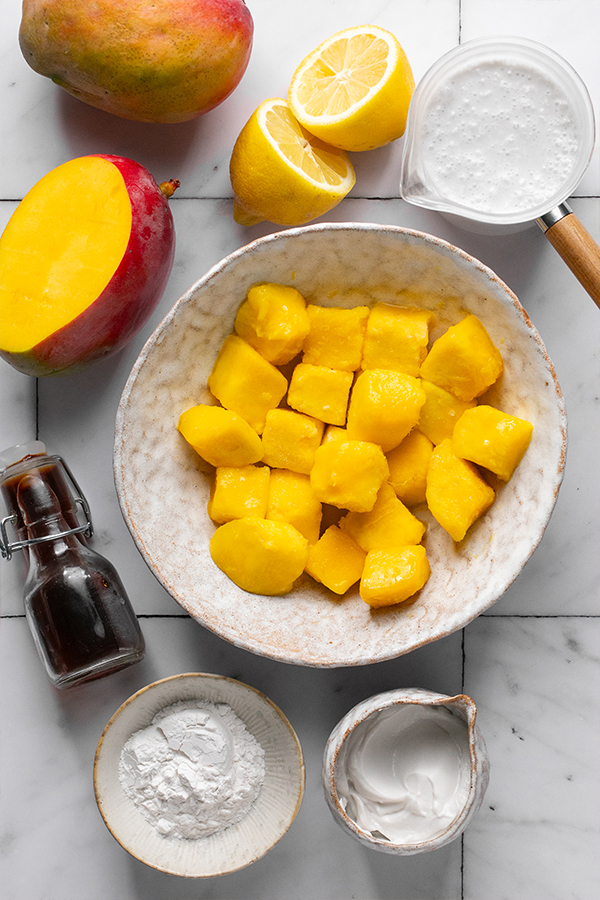 All of the ingredients for mango pudding sitting out and ready to be cooked.