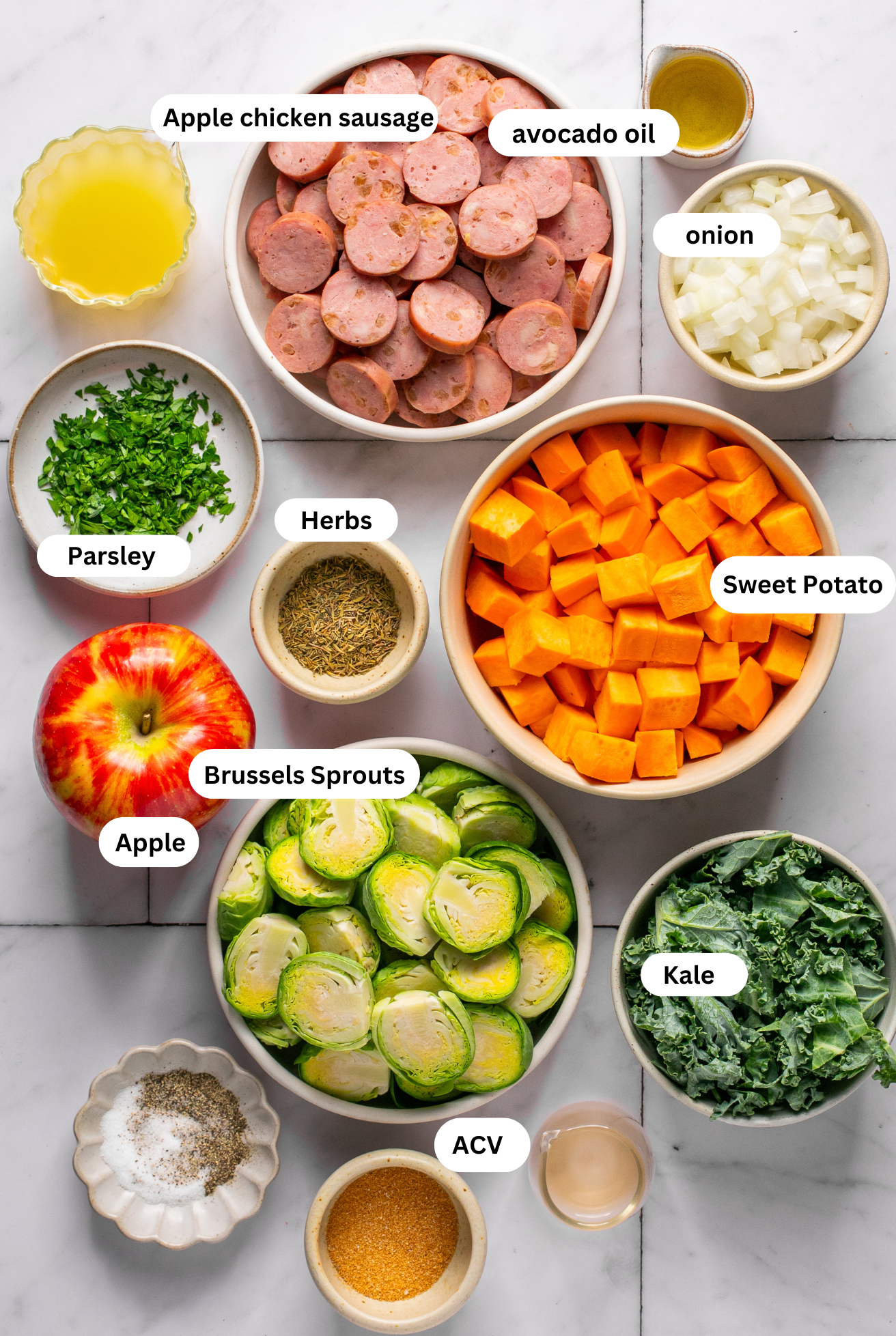 Apple chicken sausage ingredients in separate bowls. 