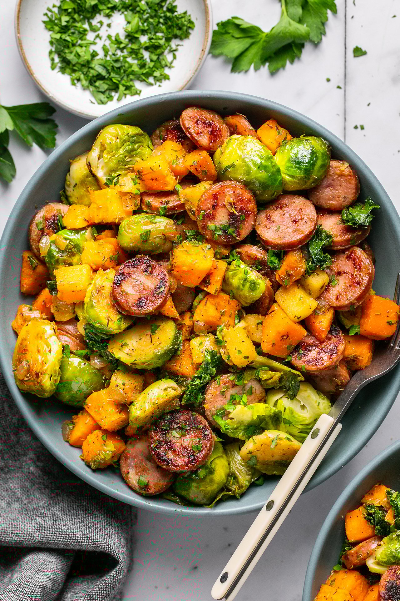 Apple chicken sausage skillet in a large bowl.