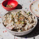 Bagel chicken salad topped with everything bagel seasoning in a bowl.