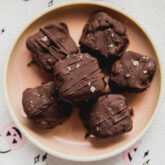 Copycat butterfinger minis on a pink plate.