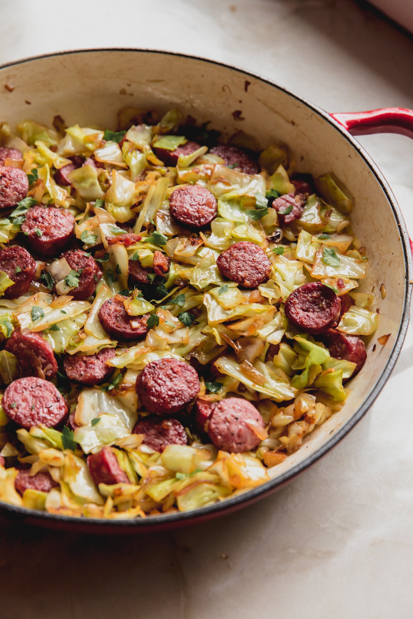Southern cabbage and sausage in a large skillet.