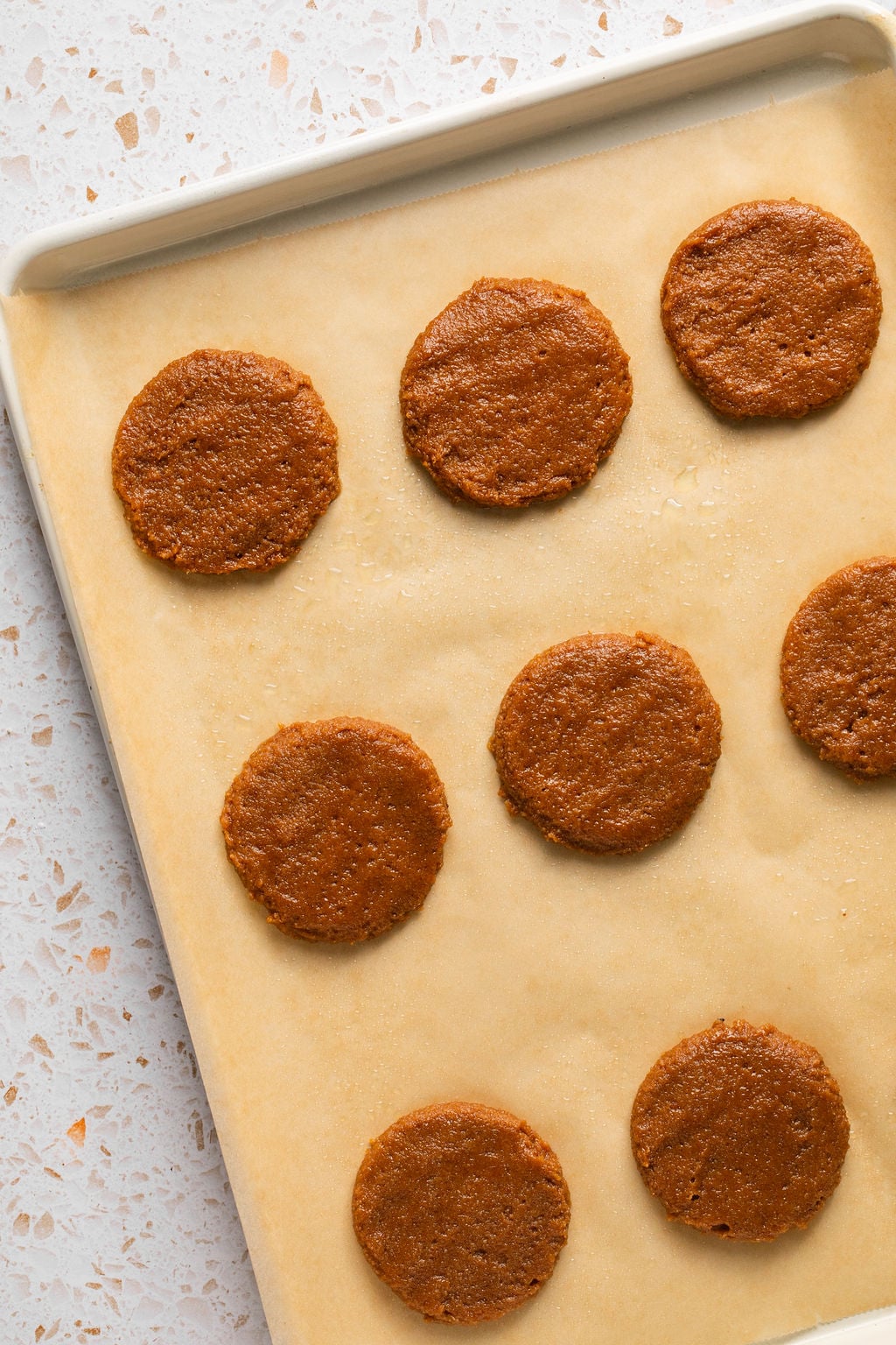 Gluten free pumpkin cookies unbaked on a baking sheet.