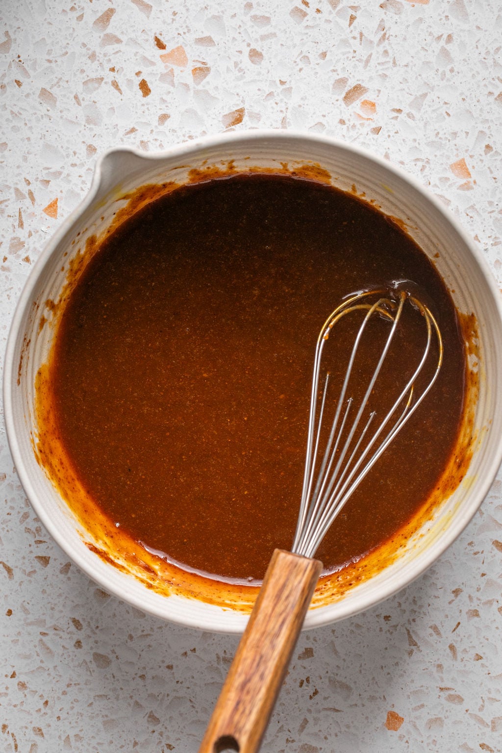Pumpkin spice cookie wet ingredients whisked in a bowl.