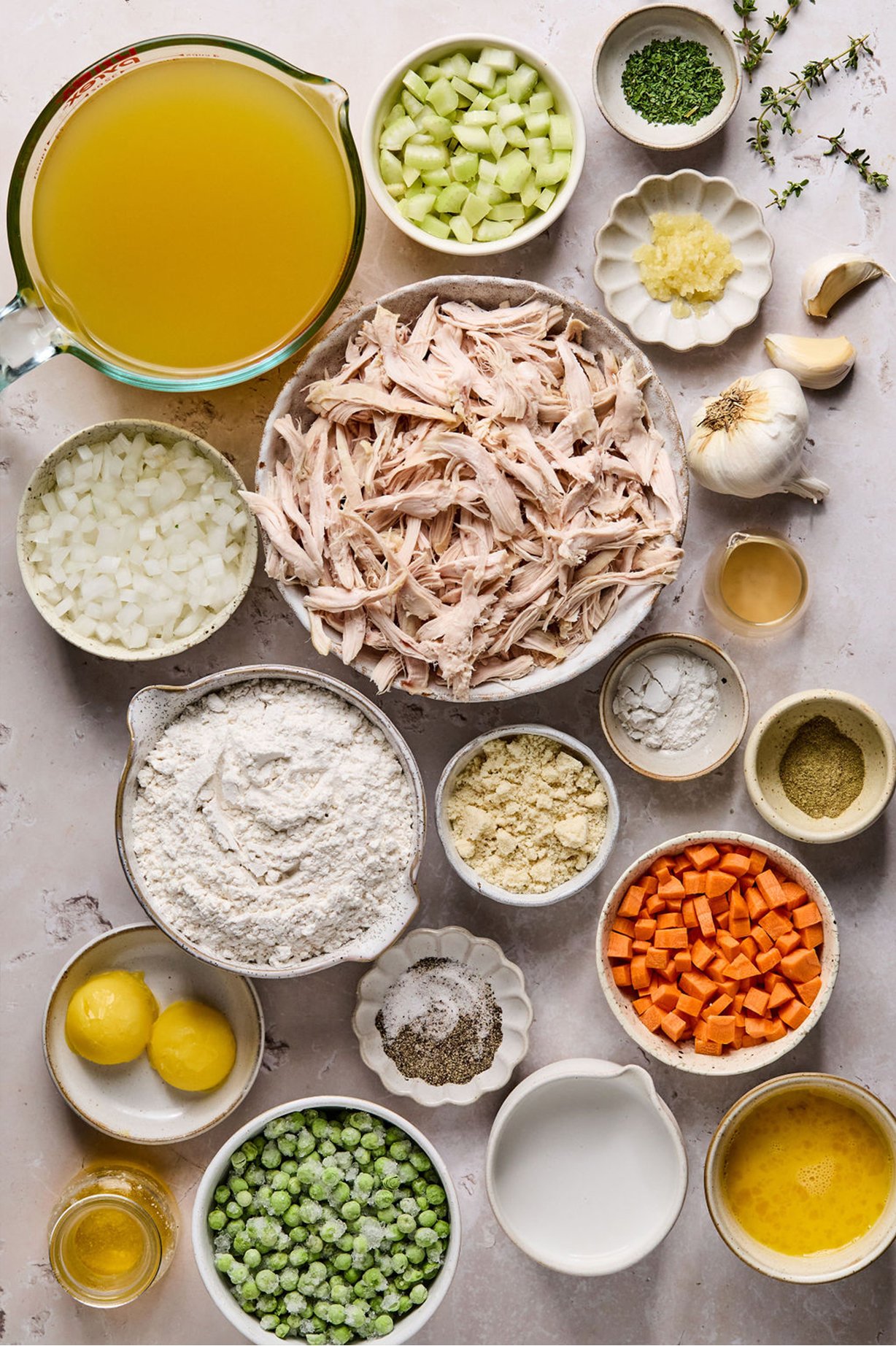 Chicken and dumpling ingredients laid out in separate bowls. 