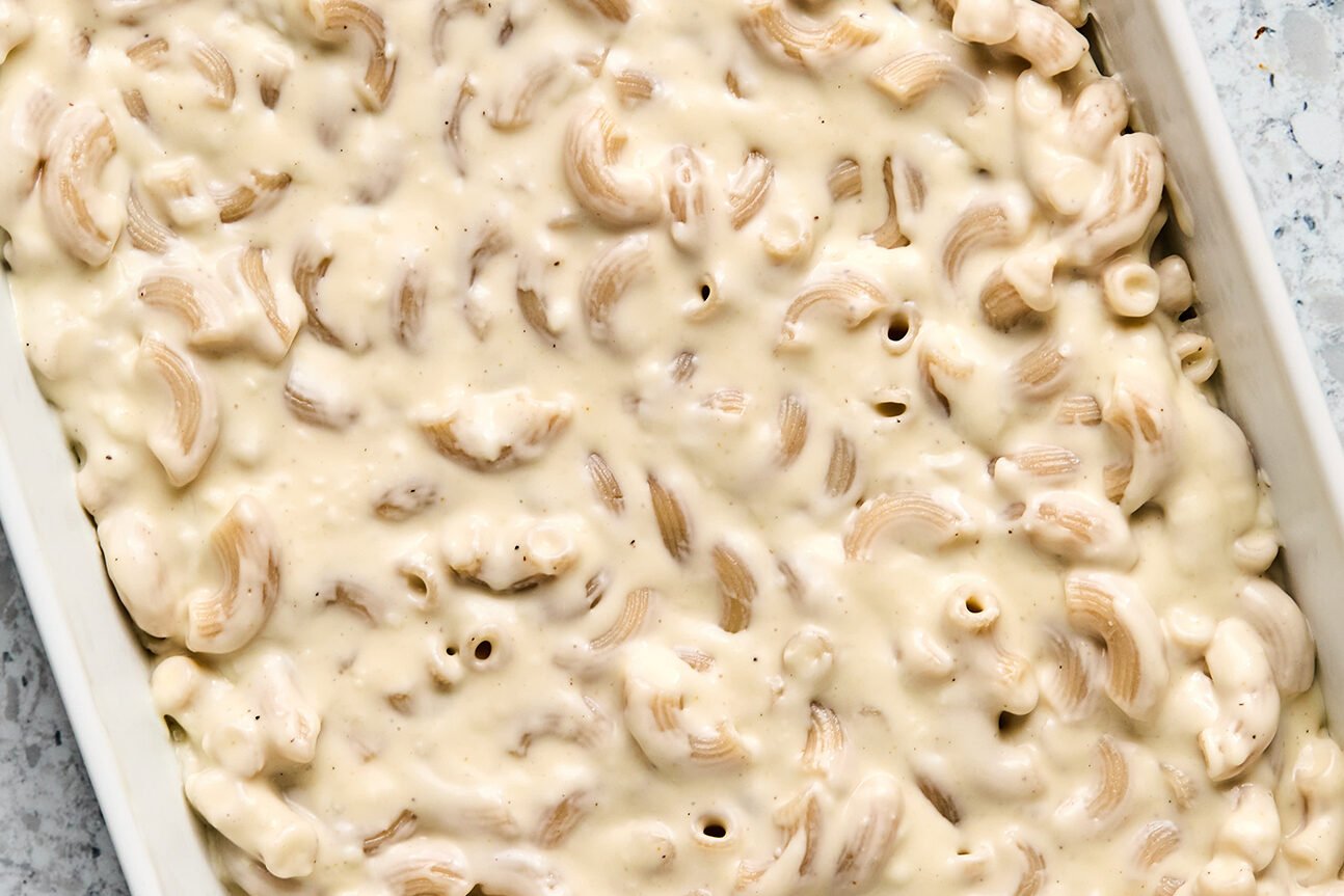 Pasta totally covered in goat cheese mac and cheese sauce.