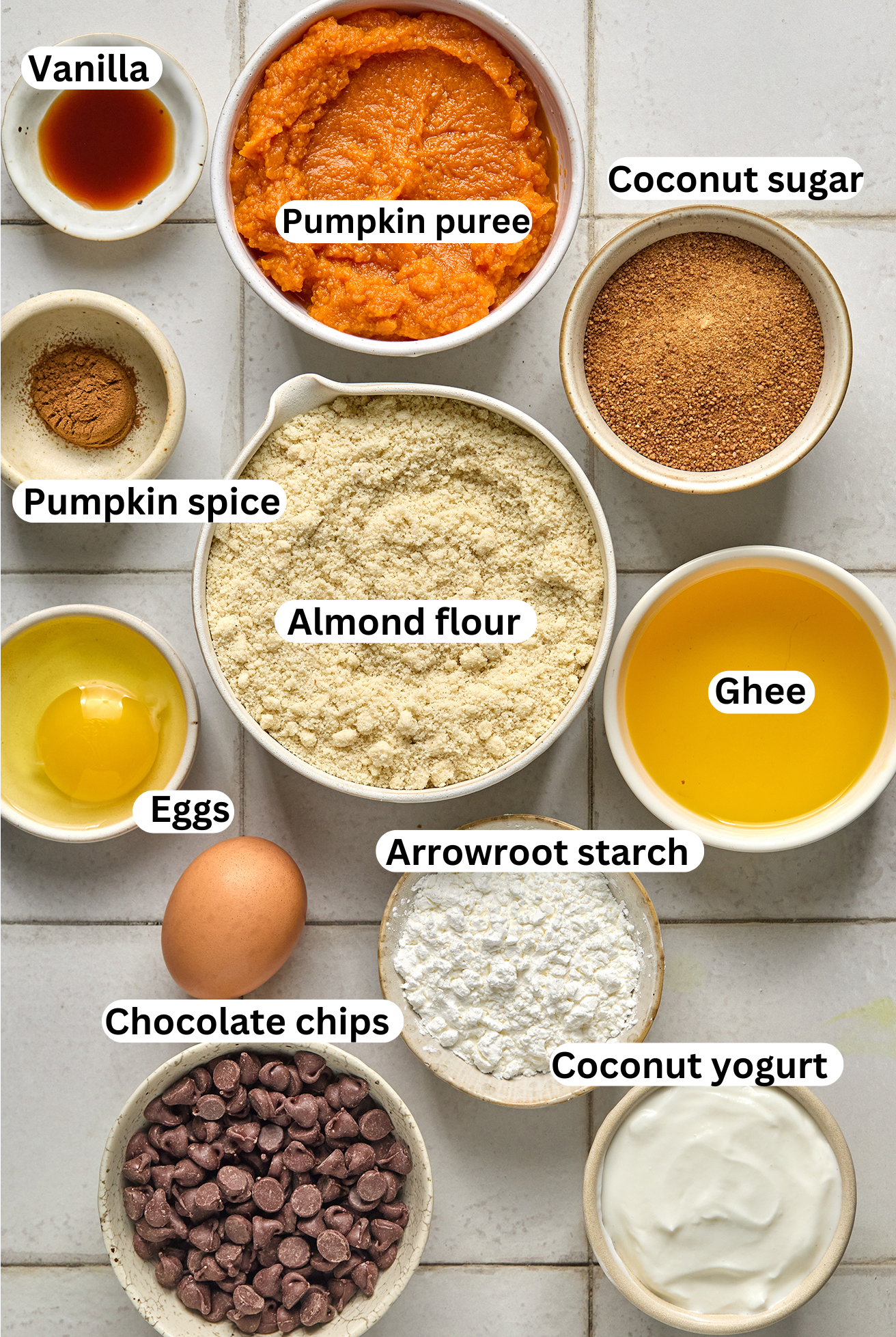 Ingredients for pumpkin pie cookie bars in individual bowls. 