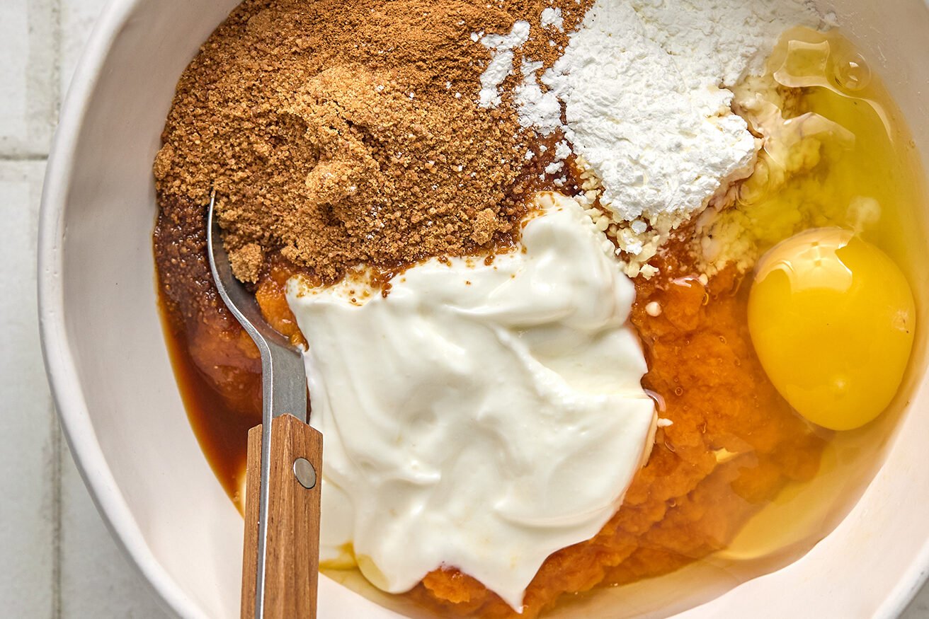 Pumpkin pie layer ingredients in a bowl, unmixed.