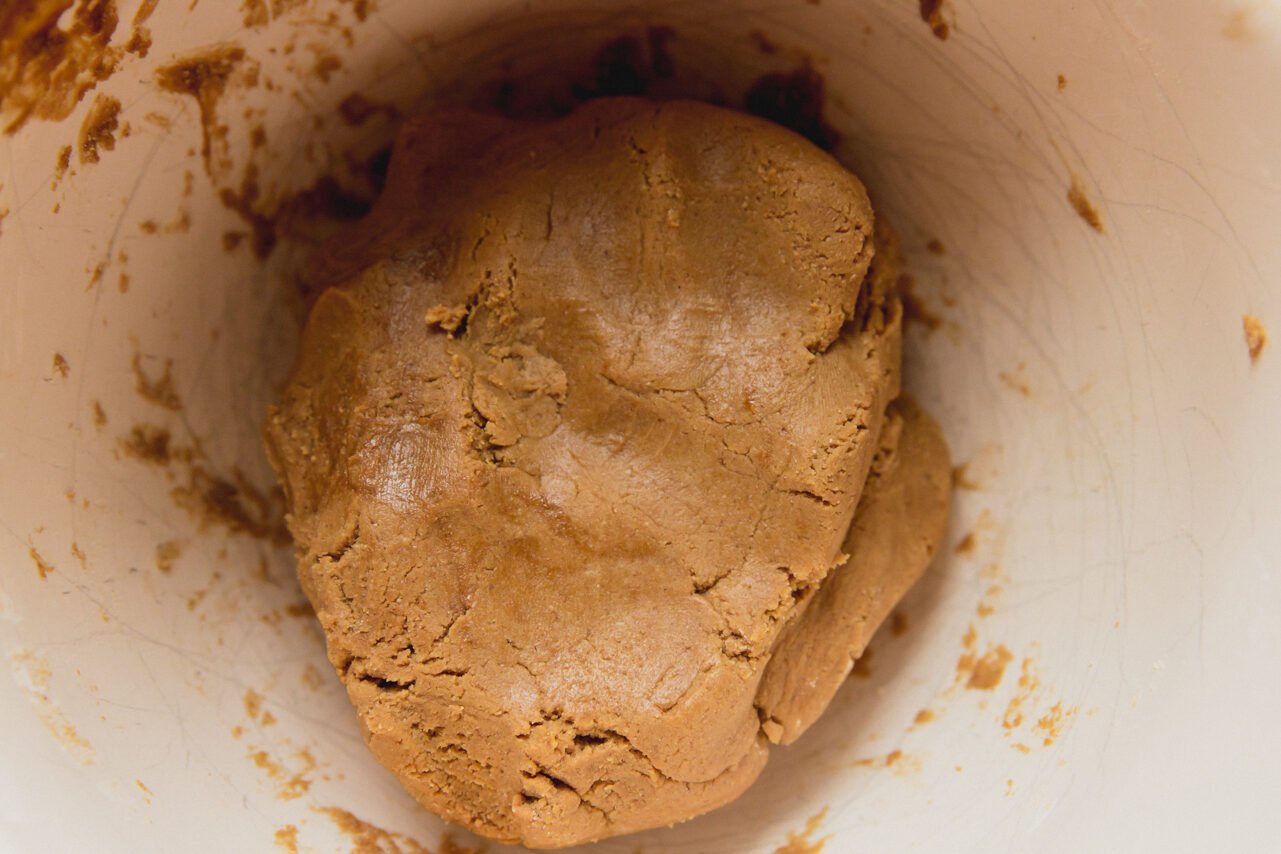 The gingerbread Rudolph reindeer cookie dough in a bowl.