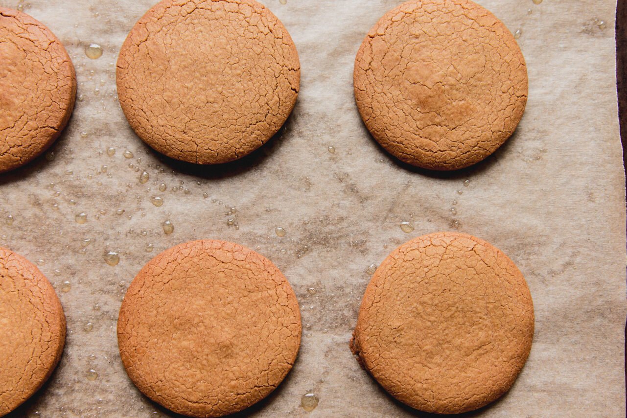 A cookie sheet with gingerbread cookies after baking.