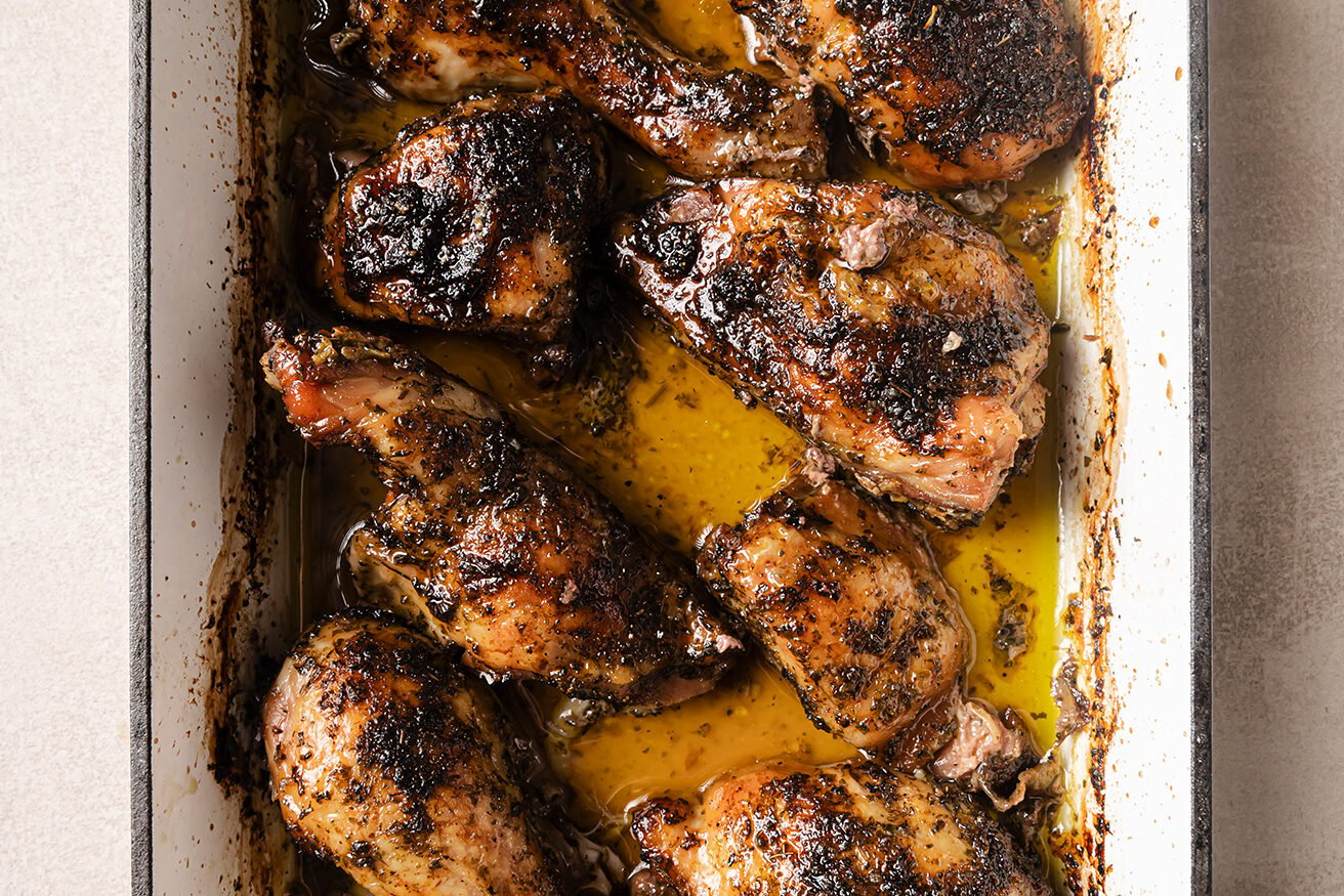 Cooked turkey wings in a baking pan.