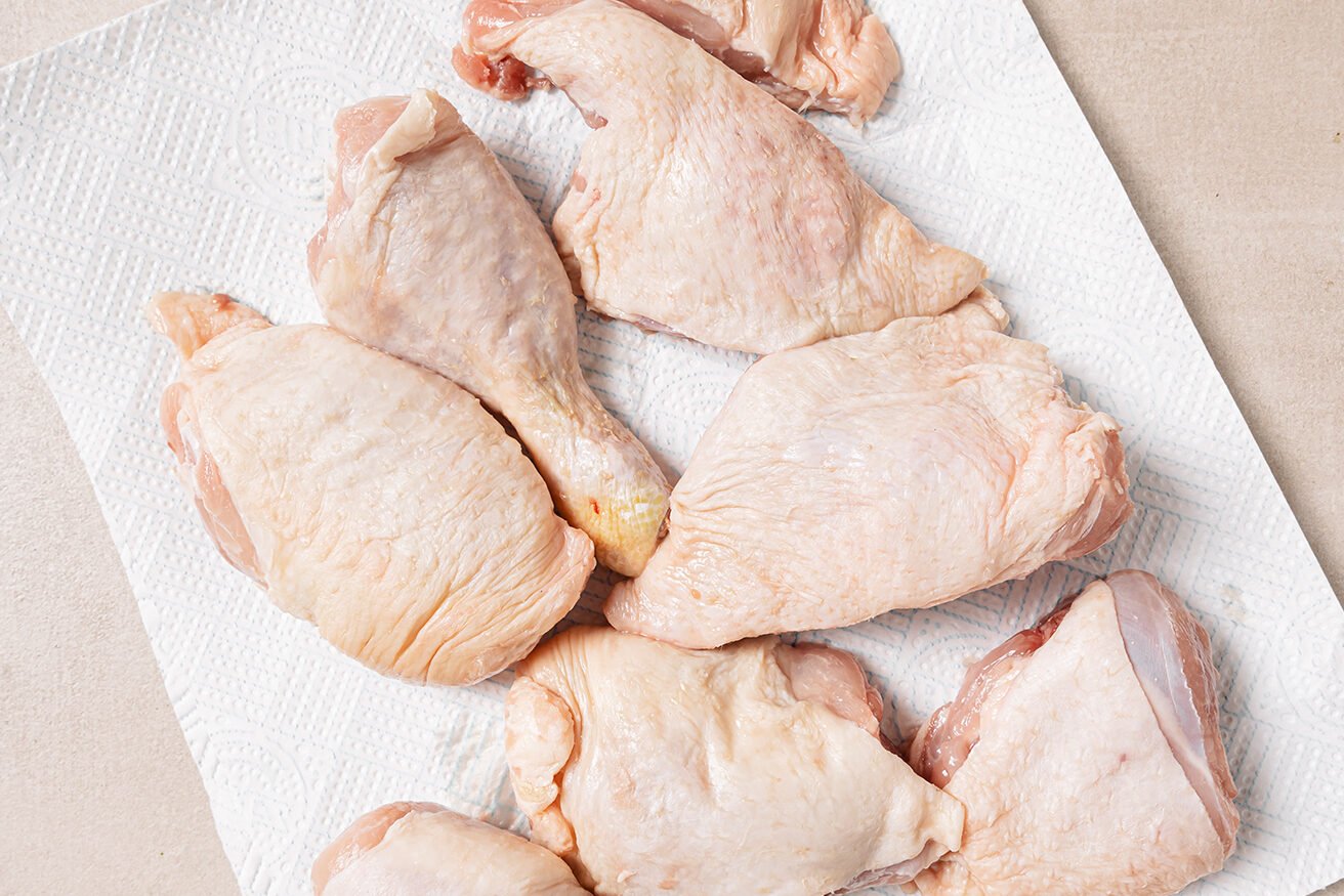 Raw turkey wings on a paper towel.