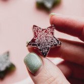 One star-shaped gum drop being picked up.