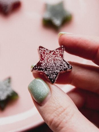 One star-shaped gum drop being picked up.