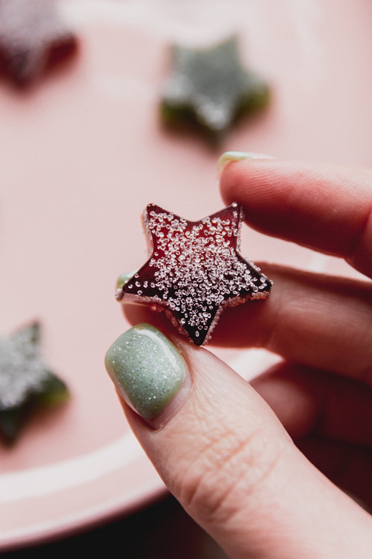 One star-shaped gum drop being picked up. 