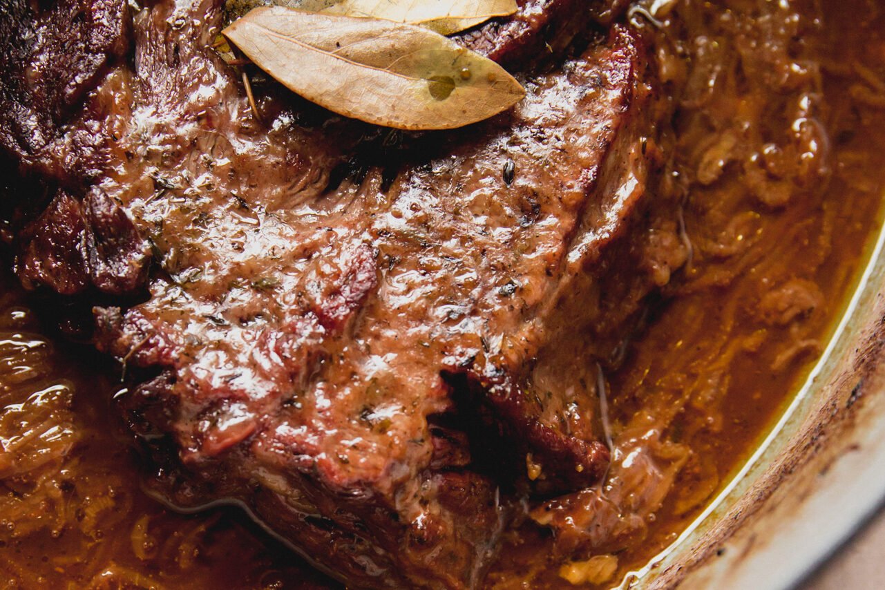 The pot roast after cooked in the oven.